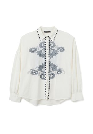 Blouse blanche avec broderie florale bleu foncé, patte de boutonnage contrastante et col pointu. Présente des manches froncées et une coupe décontractée.