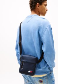 Tommy Jeans DAILY REPORTER UNISEX - Cross body bag - blue