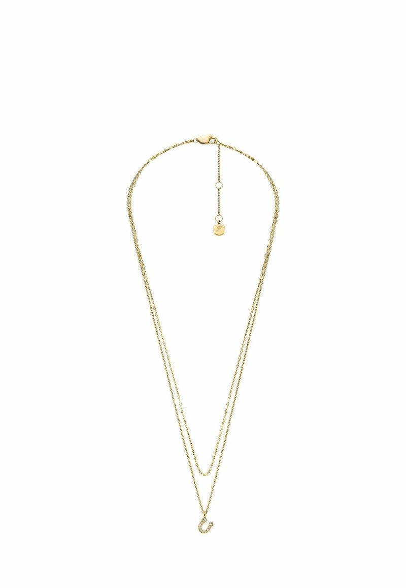 Collier en ton or avec deux chaînes superposées. Une chaîne est lisse, tandis que l'autre présente un accent décoratif avec des lettres et des strass.