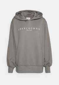 Szara bluza z kapturem o luźnym kroju, z białym logo tekstowym "ABERCROMBIE New York" na wysokości klatki piersiowej i ribbowymi mankietami.