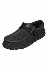 Scarpe slip-on nere con tomaia in rete testurizzata, lacci elastici, soletta imbottita e suola in gomma flessibile. Logo ben visibile sulla linguetta.