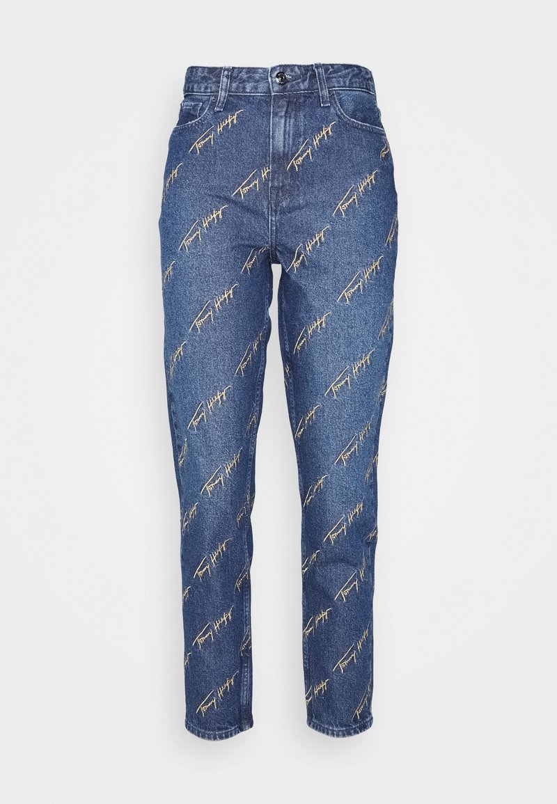 Jean en denim bleu taille haute avec broderie diagonale beige du logo Tommy Hilfiger sur l'ensemble, poches avant et fermeture par bouton.