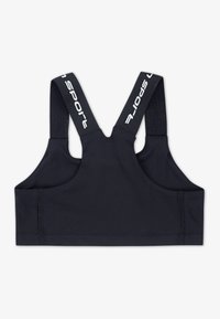 Melna sporta krūšturis ar platām siksnām, kas izgatavots no teksturēta materiāla. Muguras dizains ietver vienkāršu griezumu bez aparatūras un minimālām vīlēm.