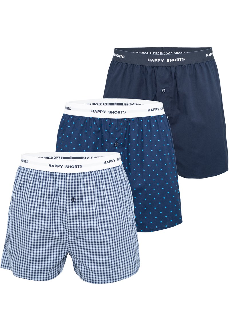Three pairs of boxers featuring a white elastic waistband labeled "HAPPY SHORTS." One pair is navy, another with blue polka dots, and the third a navy checked pattern.