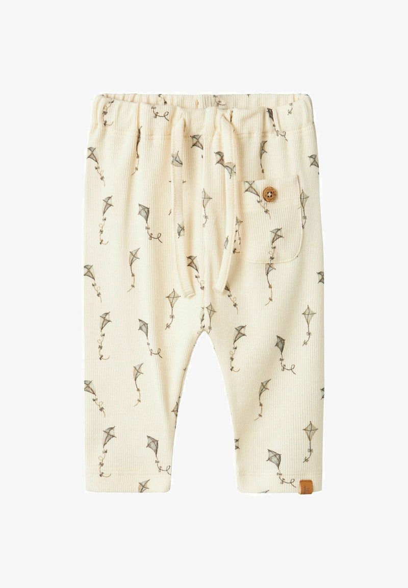 Helle beige, gerippte Hose mit einem Drachenmuster, elastischem Bund, Kordelzug und einem Holzknopf an der Seitentasche.