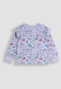Top de manga larga color lila claro con estampado de dinosaurios y flores, con detalles de volantes en los hombros y puños acanalados. Tejido de algodón.