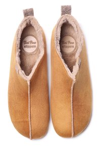 Honey-colored suede slippers with soft, plush lining, rounded toe design, and a small fabric loop at the heel for easy wear.