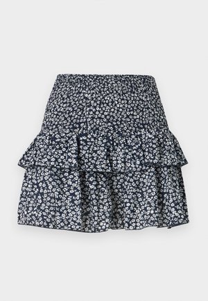Mørkeblå lagdelt nederdel med hvidt blomsterprint og elastisk talje med rynke.