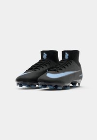 Black soccer cleats with a high ankle design, featuring a blue swoosh and clear studs. Smooth texture with a sleek, modern outline.
