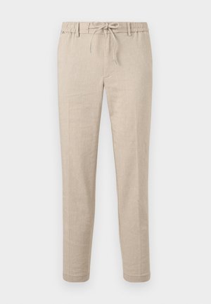 Beige smale bukser med snor i midjen, beltehemper og sidelommer, vist flatt mot en hvit bakgrunn.