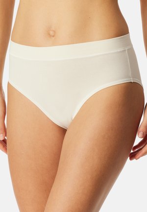 White cotton hipster underwear with a smooth texture, elastic waistband, and seamless sides. Designed for comfort and a minimalistic look.