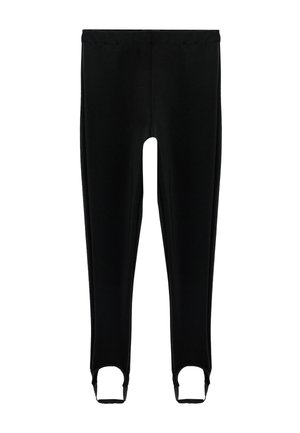 Leggings negros de longitud completa con correas para los pies diseñadas para sujetarse debajo de los pies.