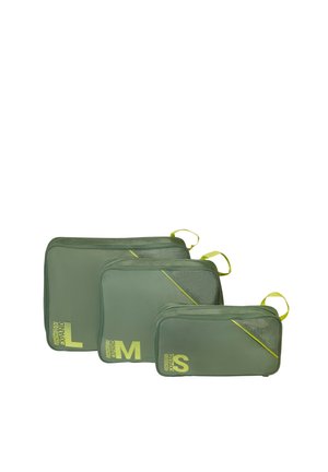 Three olive green packing cubes in small, medium, and large sizes, each with yellow zipper pulls and size labels on corners.
