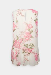 Blusa sem mangas com padrão floral rosa em fundo branco. Apresenta uma abertura em forma de olho-chave nas costas e uma bainha com babados.