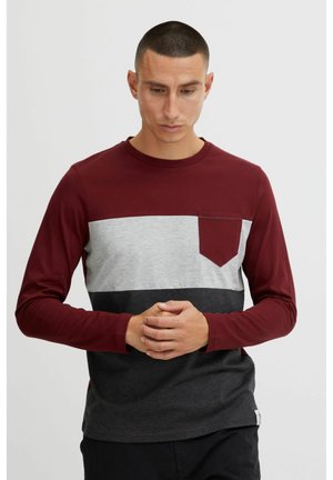 Long-sleeve t-shirt featuring burgundy, gray, and black horizontal stripes with a chest pocket. Made from soft cotton material.