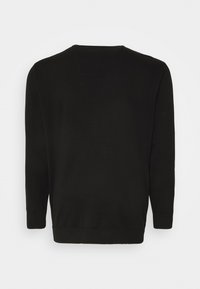 Pull en maille noir avec des manches longues, col rond et ourlet côtelé. Texture lisse, design simple, sans motifs ni quincaillerie visibles.