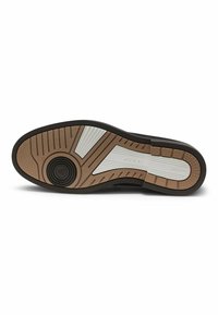 Suola di scarpa in gomma marrone con superficie texturizzata, caratterizzata da accenti a motivo bianco e un logo circolare sul tallone.