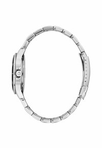 Orologio in acciaio inox posizionato di lato, con un quadrante rotondo, una lunetta strutturata e un bracciale metallico con anelli ovali.