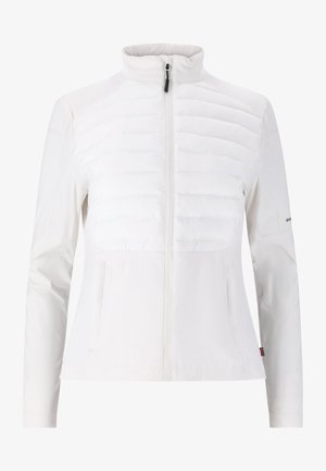 Valkoinen takki, jossa on vetoketjullinen etuosa, näyttäen tikatun ylöspuolen ja sileän alaosan. Korkea kaulus ja kaksi sivutaskua.