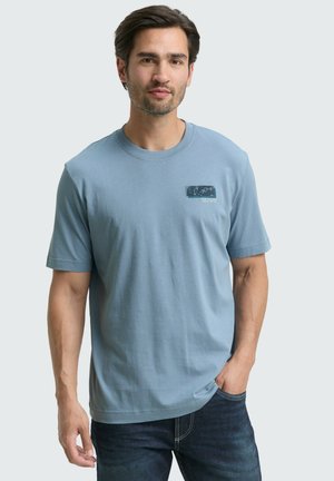 Lichtblauw katoen T-shirt met korte mouwen en een ronde halslijn, met een grafische print op het linker borstgebied.