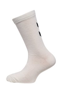 Chaussette en coton blanc, style crew, avec une bordure côtelée ; présente un design graphique noir sur le côté ; texture lisse et forme traditionnelle.
