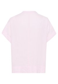 Top à manches courtes, rose clair, fabriqué à partir d'un tissu doux et texturé. Design simple avec une coupe droite et sans éléments métalliques visibles.