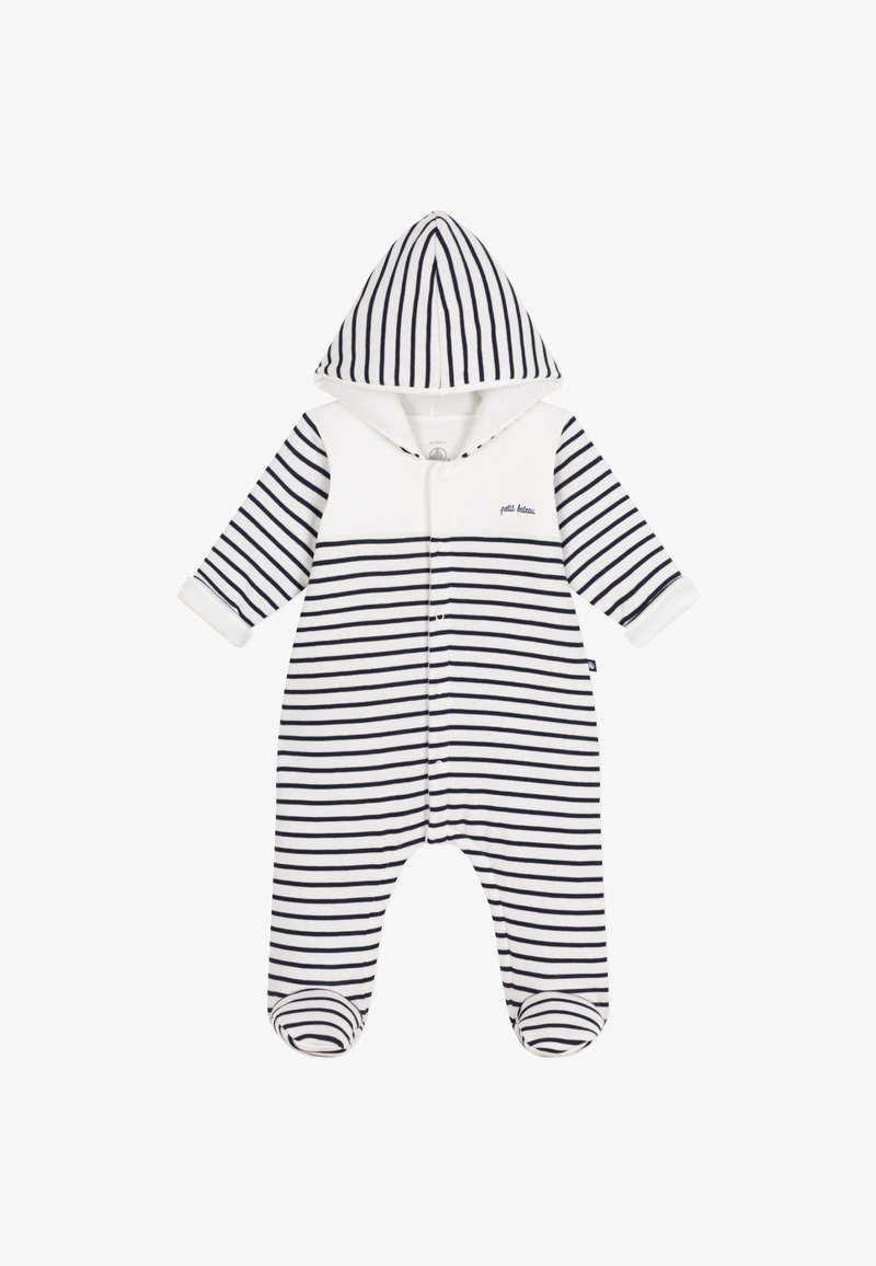 Combinaison à rayures avec capuche, présentant des rayures alternées bleu marine et blanches, fermeture à pression et poignets côtelés. Matériau en coton doux.