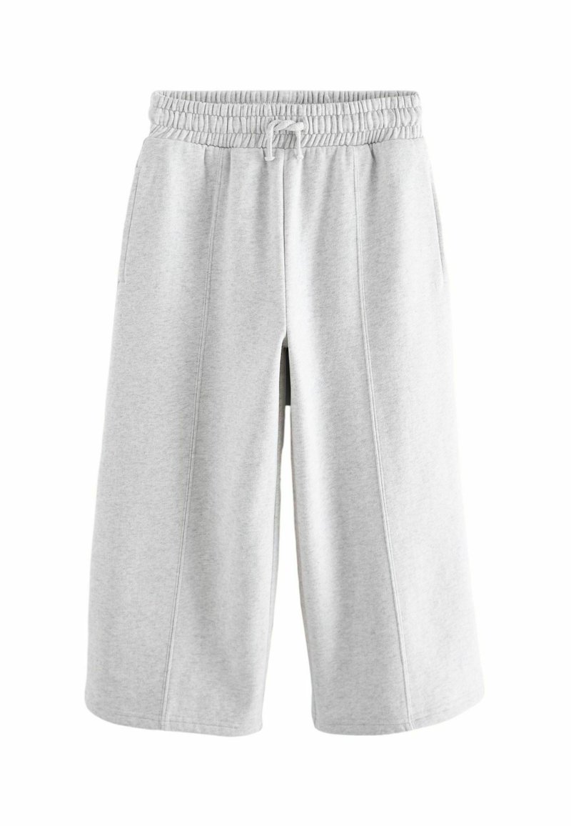 Lysegrå svedshorts lavet af blødt stof, med elastisk talje med snor, sidelommer og en afslappet pasform.