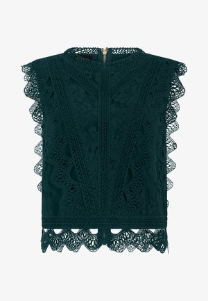 Haut sans manches en dentelle vert foncé avec motifs floraux, bords festonnés et fermeture éclair au dos.
