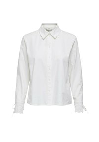 Camicia bianca a maniche lunghe in cotone. Presenta un colletto classico, chiusura con bottoni e dettagli ricamati sui polsini con ritagli circolari.