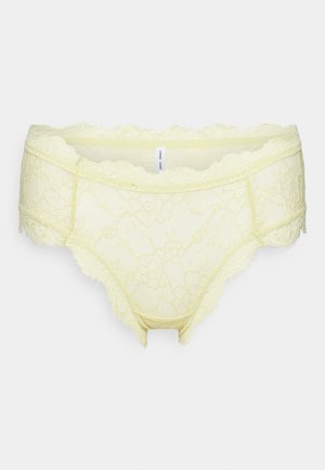 Culotte en dentelle de couleur jaune pâle avec des motifs floraux, des bords festonnés et une texture transparente pour une apparence délicate.