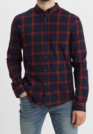 Marinblå och röd rutig flanellskjorta med knäppkrage, långa ärmar och rak fåll, med mjuk textur och klassisk passform.