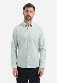Een knoopshirt in lichtgroen met een geometrisch patroon, lange mouwen en een puntige kraag. Voorzien van beige knopen en een gladde textuur.