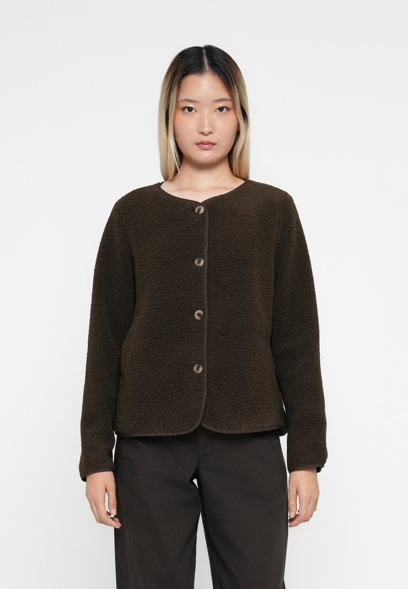 Dark brown fleece jacket with a round neckline, five button closure, and long sleeves. Features soft texture and contrasting trim.