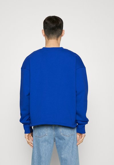 Nikolaj Storm RODEO UNISEX - Bluză de molton - logo blue