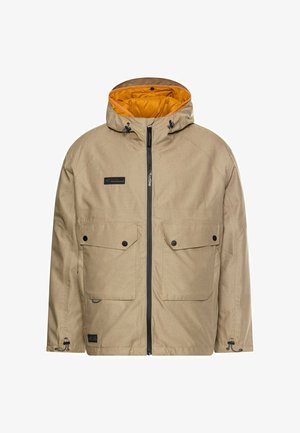 Beige jakke med hætte, med en gul foring. Inkluderer to frontlommer med klapper, en frontlynlås og justerbare snore.