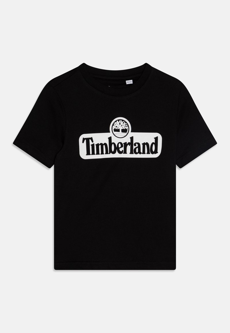 Black t-shirt made of cotton, featuring a white "Timberland" logo with tree graphic centered on the chest. Crew neckline and short sleeves.