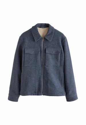 Marineblaue Wollmischjacke mit Reißverschluss, zwei Brusttaschen, Kragen und einem weichen, cremefarbenen Futter.