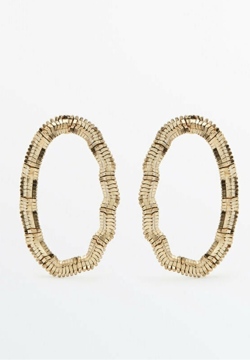 Oval-shaped gold-tone earrings made of small stacked rectangular segments with a slightly irregular outline.