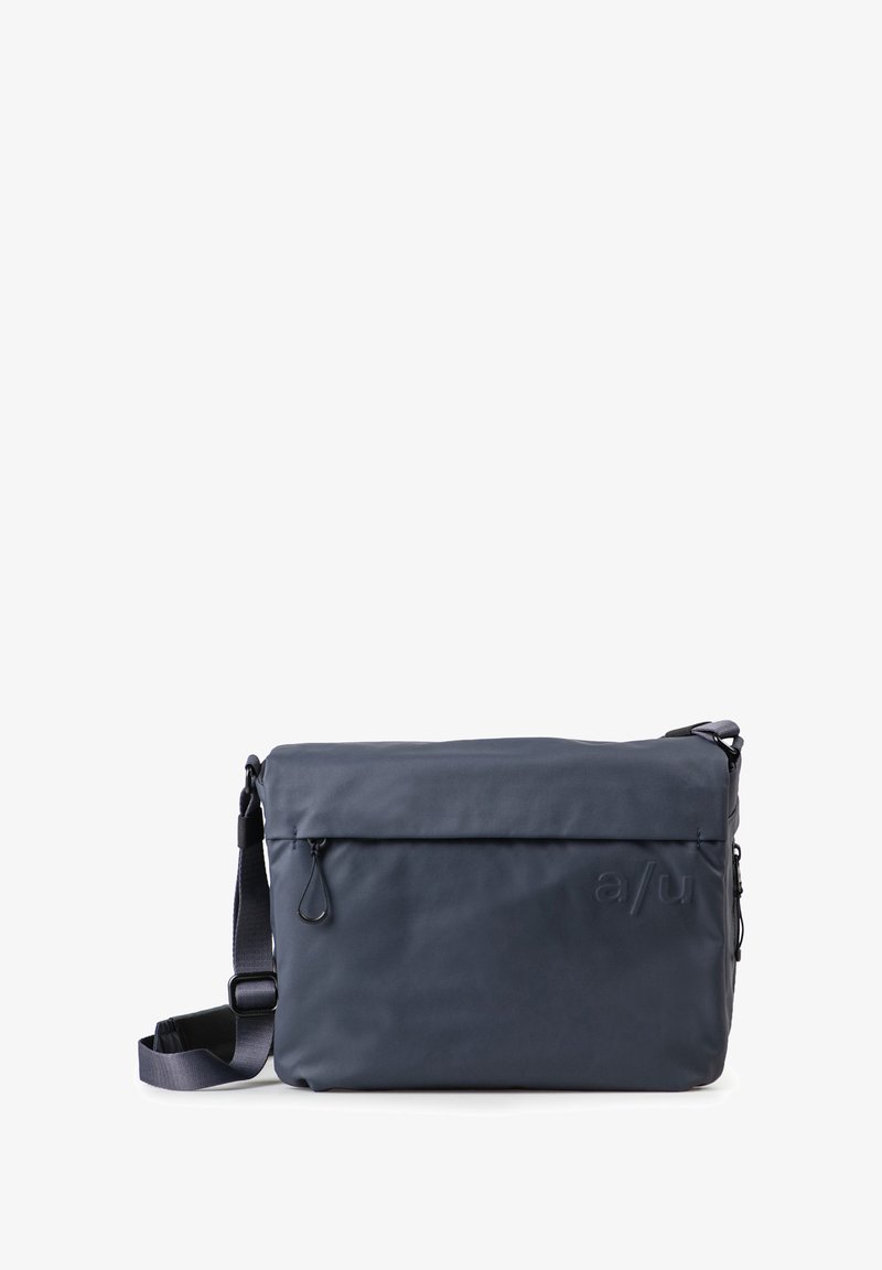 Dark blue, rectangular messenger bag with a textured finish, adjustable strap, top flap closure, and a front zip pocket.