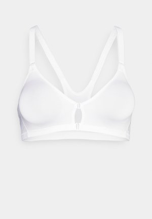 White wireless bra made from smooth fabric. Features adjustable straps, a keyhole front detail, and minimalist design without additional embellishments.