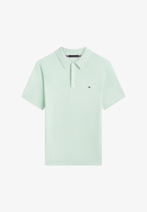 Lichtgroen polo met korte mouwen, drie knopen en een klein geborduurd Tommy Hilfiger-logo op de linkerborst.