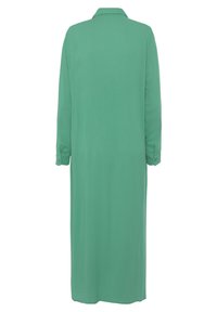 Langes, einfarbiges grünes Kleid aus weichem Stoff. Verfügt über einen Kragen und geknöpfte Manschetten. Das Design ist schlicht mit geradem Schnitt.