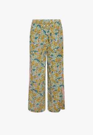 Pantalones de pernera ancha con cintura elástica, cubiertos con un estampado floral denso con flores amarillas, blancas y rosas sobre un fondo verde azulado.