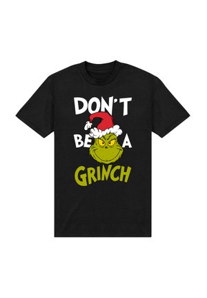 Sort t-shirt med et grafisk motiv af Grinch, der bærer en julesanta-hat, med hvid og grøn tekst, der siger: "VÆR IKKE EN GRINCH."