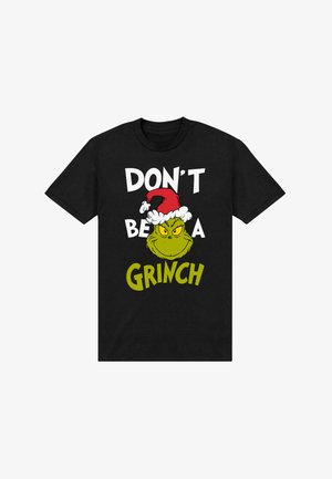 Sort t-shirt med et grafisk motiv af Grinch, der bærer en julesanta-hat, med hvid og grøn tekst, der siger: "VÆR IKKE EN GRINCH."
