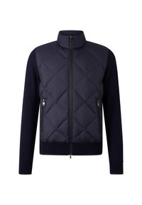 Veste matelassée navy avec col montant, fermeture éclair à l'avant et deux poches latérales. Présente des manches en tricot et un ourlet, avec une finition lisse.