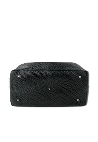 Black leather bag with woven texture, rectangular shape, metal studs on the bottom, and smooth top finish. Compact design for versatility.