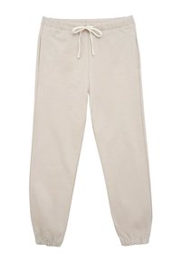 Beżowe spodnie dresowe z elastycznym pasem i regulowanym sznurkiem. Posiadają dwie boczne kieszenie oraz zwężane mankiety na kostkach. Miękka tekstura.