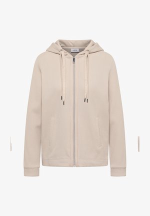 Sweat à capuche beige avec fermeture éclair, tissu texturé, poches avant, cordons avec embouts métalliques, et une étiquette cousue à l'intérieur du col portant l'inscription "Cecil".